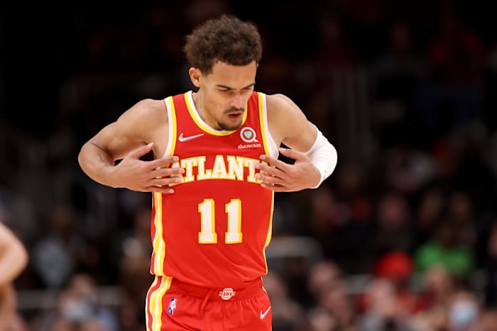 Trae Young reacts after making a shot.